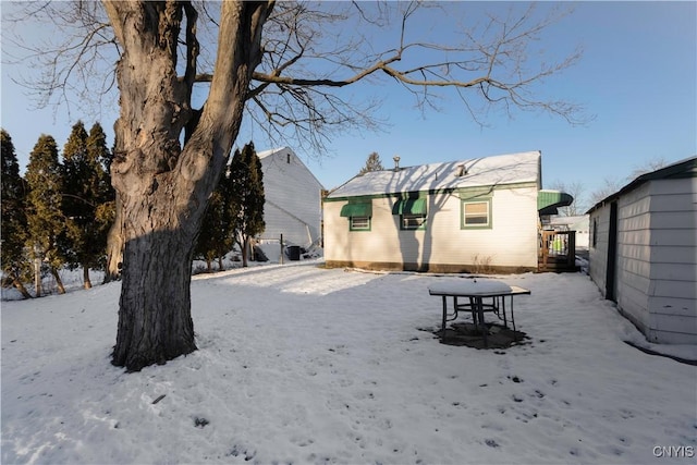 view of snow covered house