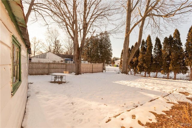 view of yard layered in snow