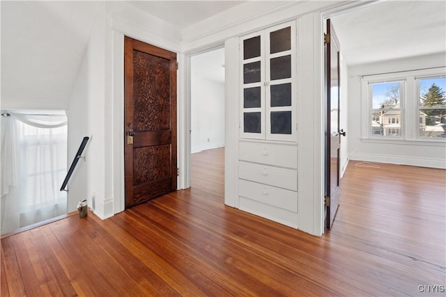 empty room with hardwood / wood-style flooring