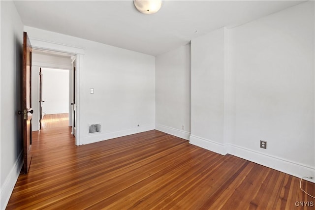 empty room featuring dark hardwood / wood-style floors