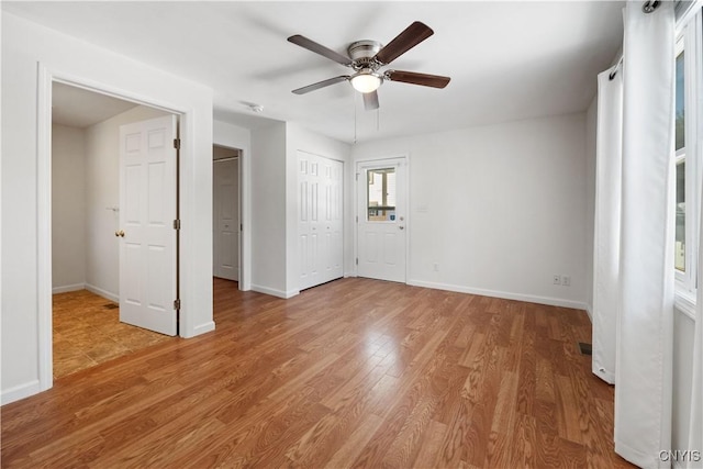 unfurnished bedroom with hardwood / wood-style floors and ceiling fan