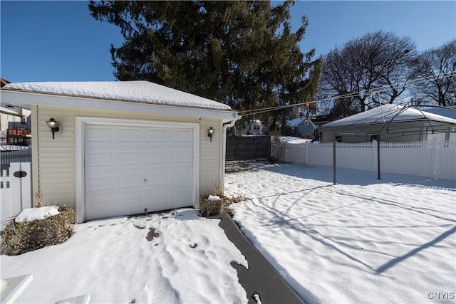 view of snow covered garage