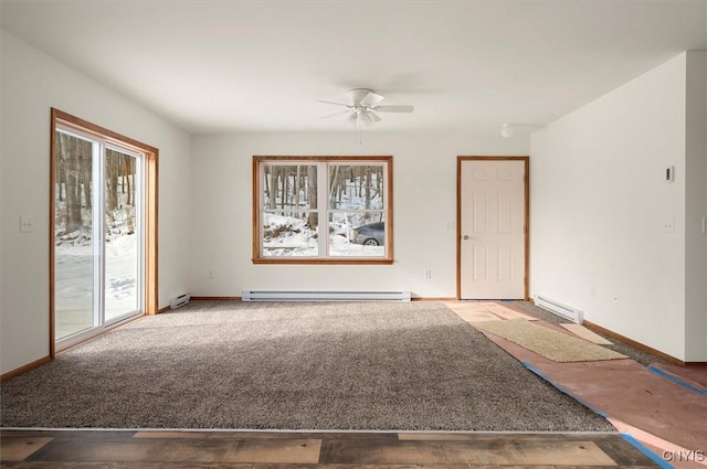 unfurnished room with ceiling fan, a baseboard radiator, plenty of natural light, and carpet