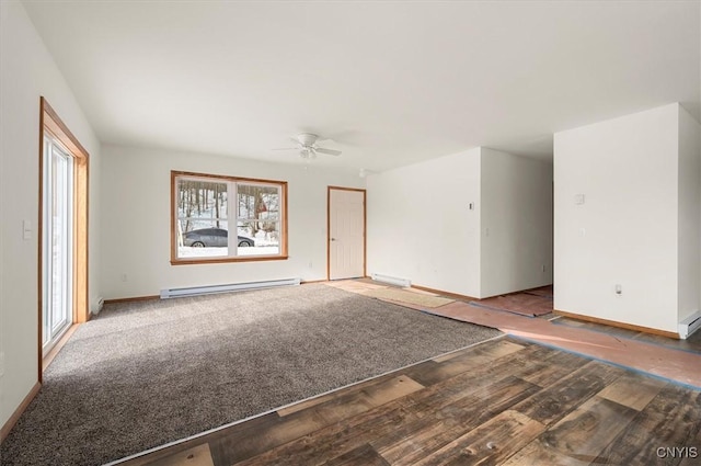 empty room with a baseboard heating unit and ceiling fan