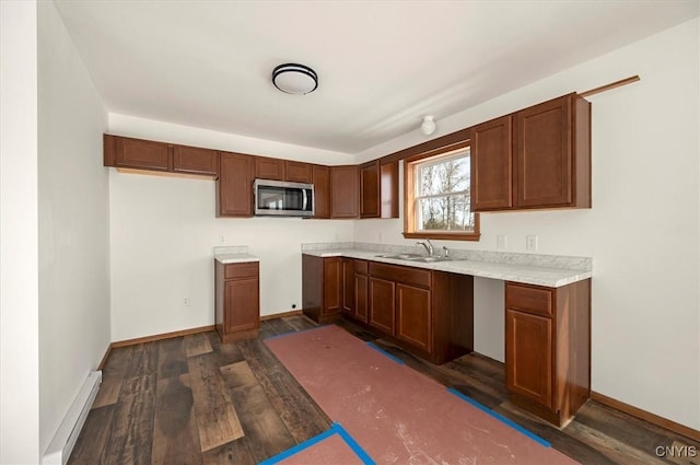 kitchen featuring dark hardwood / wood-style floors and sink