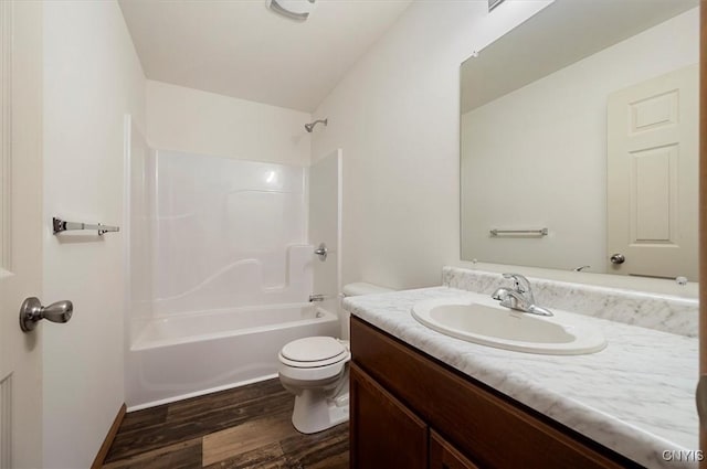 full bathroom with vanity, toilet, tub / shower combination, and hardwood / wood-style floors