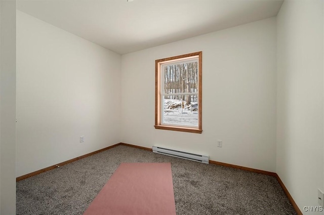 unfurnished room featuring a baseboard radiator and carpet floors