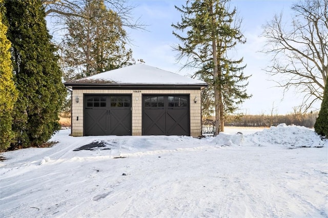 view of snow covered garage