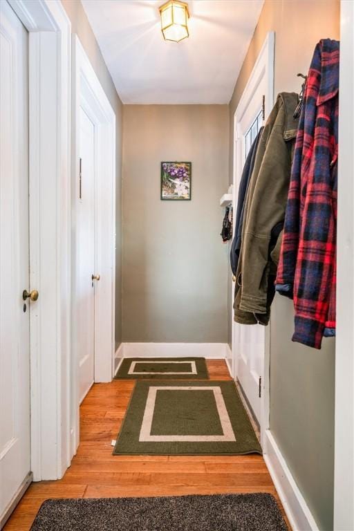 mudroom with wood-type flooring