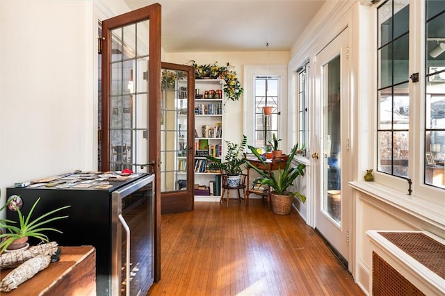 interior space with radiator heating unit and french doors