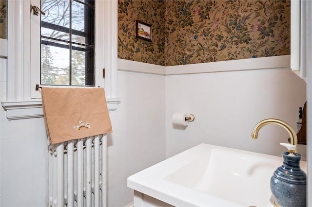 bathroom featuring sink and radiator