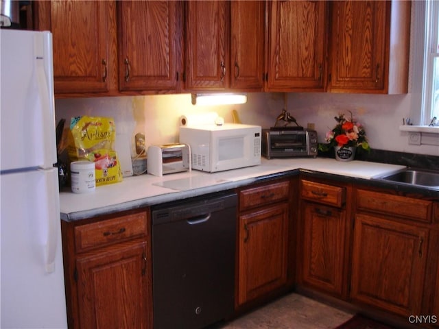 kitchen with sink and white appliances