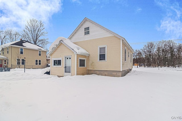 view of snow covered house