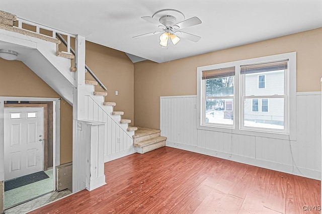 foyer with hardwood / wood-style floors and ceiling fan