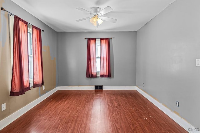 spare room featuring hardwood / wood-style flooring and ceiling fan