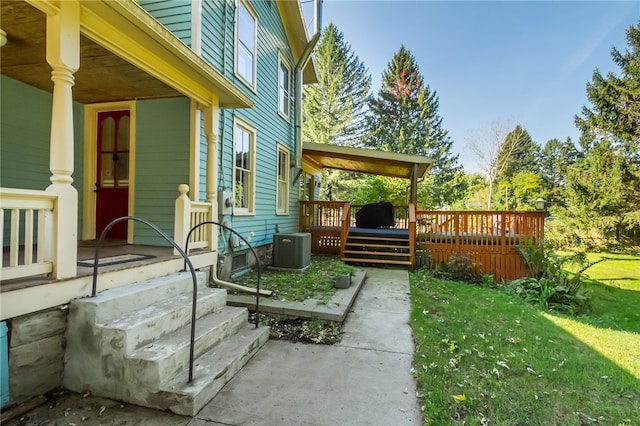 view of patio / terrace with central AC and a wooden deck