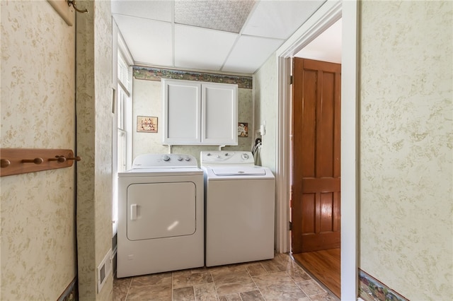 laundry area with cabinets and independent washer and dryer