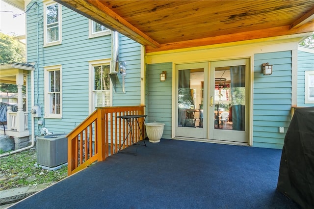 exterior space featuring cooling unit and french doors