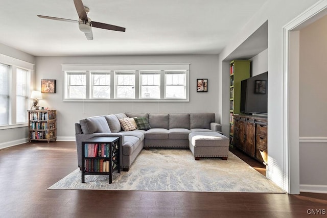 living room featuring hardwood / wood-style flooring and ceiling fan