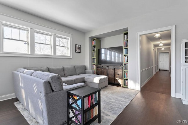 living room featuring dark wood-type flooring