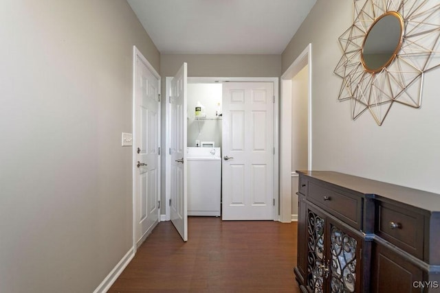 hall featuring washer / clothes dryer and dark hardwood / wood-style floors