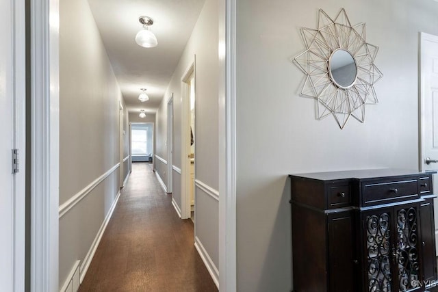 corridor featuring dark hardwood / wood-style floors