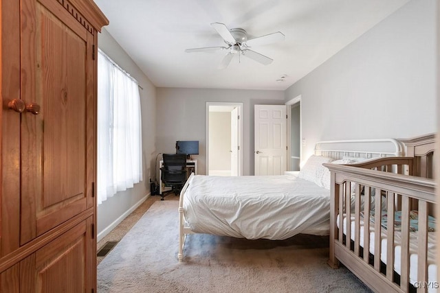 bedroom with light colored carpet and ceiling fan