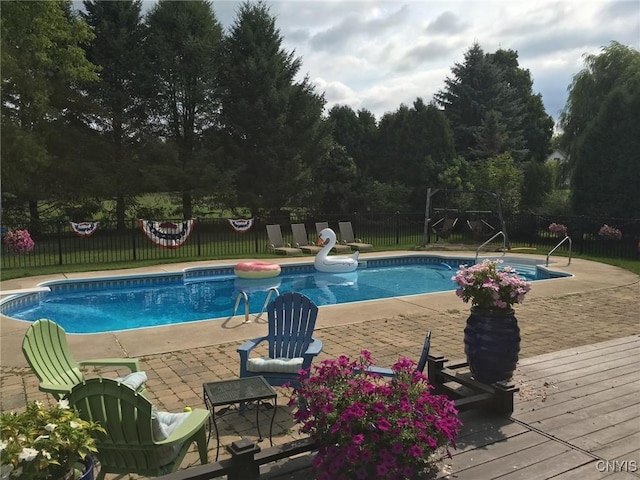 view of pool with a water slide