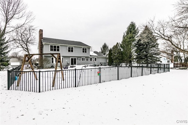 view of snow covered house