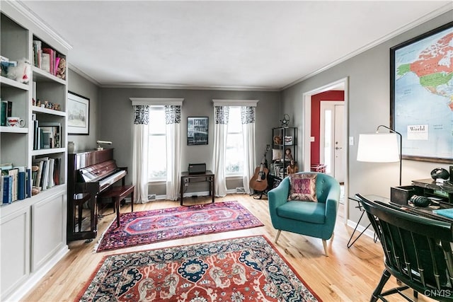 living area with ornamental molding and light wood-type flooring