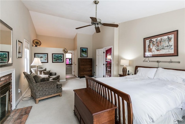 bedroom with lofted ceiling, light carpet, a fireplace, and ceiling fan