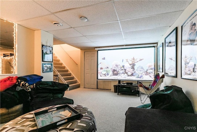 home theater featuring carpet flooring and a drop ceiling