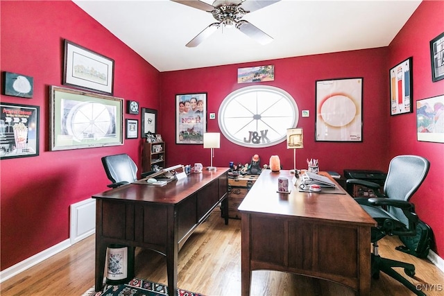 office space featuring vaulted ceiling, light hardwood / wood-style floors, and ceiling fan