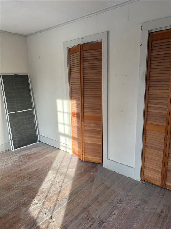 unfurnished bedroom featuring wood-type flooring