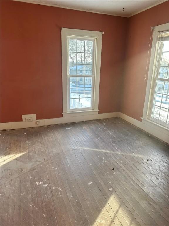 unfurnished room featuring wood-type flooring