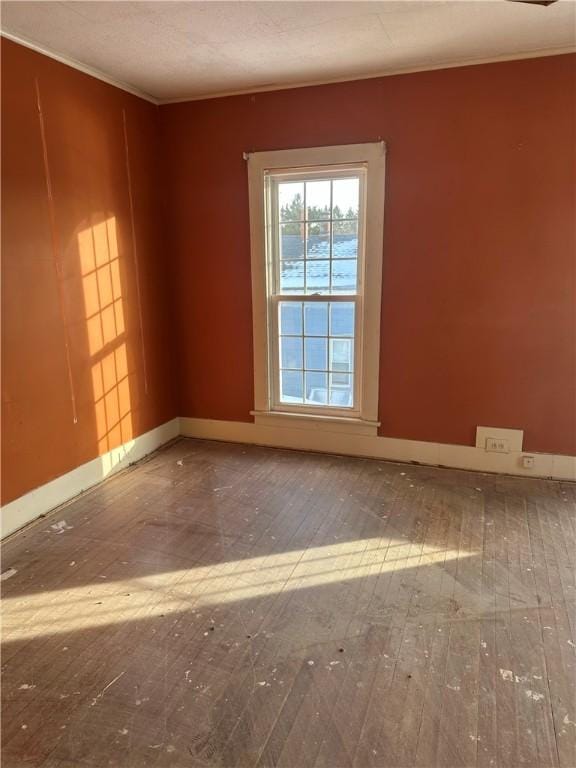 spare room featuring hardwood / wood-style flooring