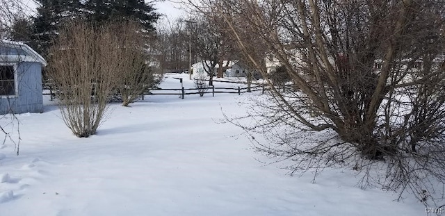 view of yard covered in snow