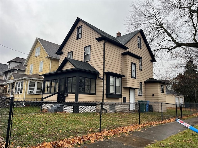 view of side of home with a lawn