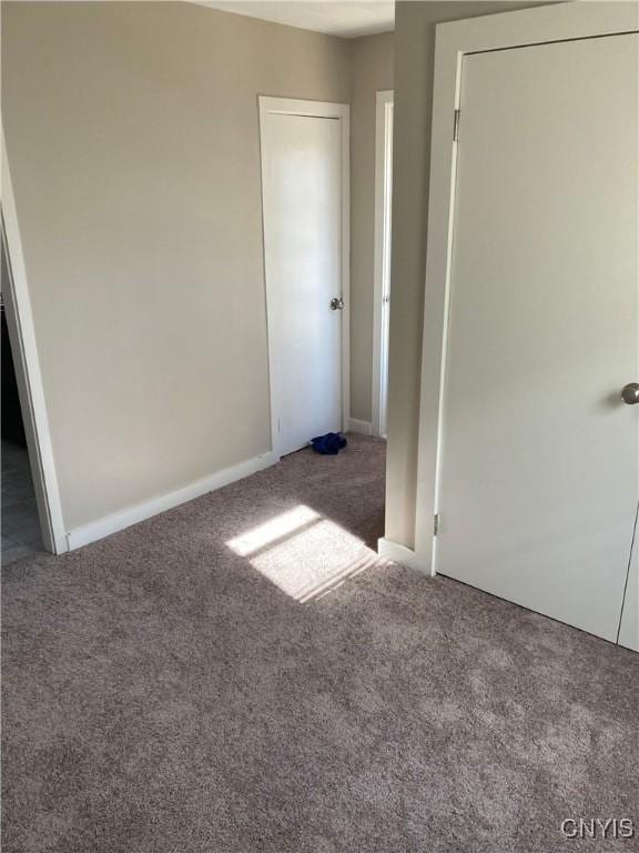 unfurnished bedroom featuring carpet flooring