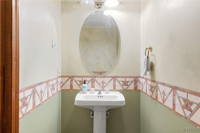 bathroom with tile walls