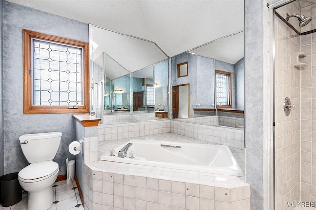 bathroom featuring tile patterned flooring, a textured ceiling, a wealth of natural light, and separate shower and tub