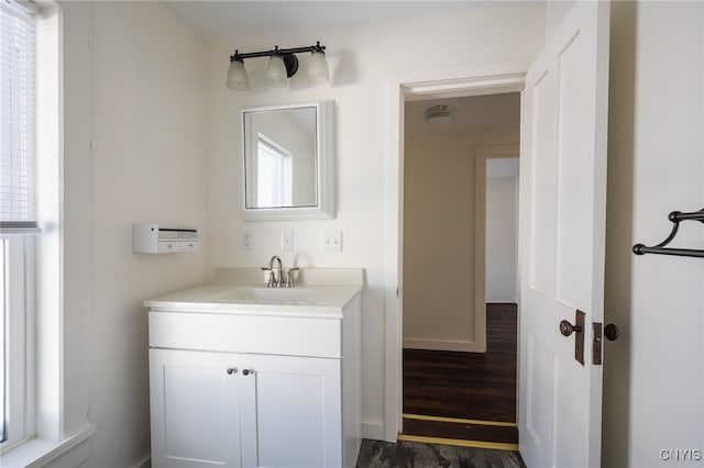 bathroom featuring vanity and hardwood / wood-style floors