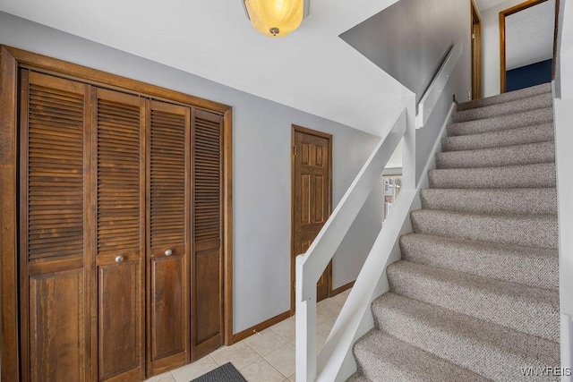 staircase with tile patterned flooring