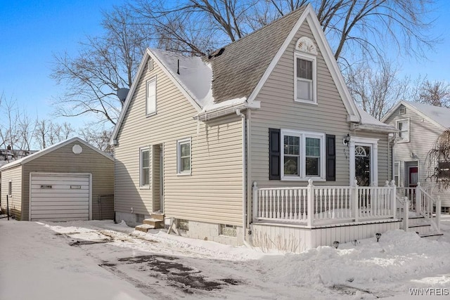 view of front of home featuring a garage and an outdoor structure