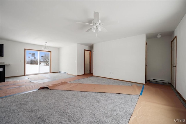 unfurnished living room with a baseboard heating unit, ceiling fan with notable chandelier, and light colored carpet