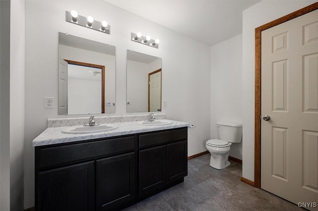 bathroom featuring vanity and toilet