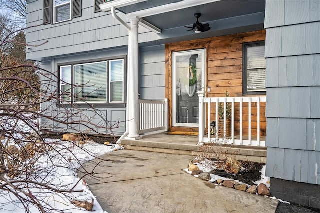 entrance to property featuring ceiling fan