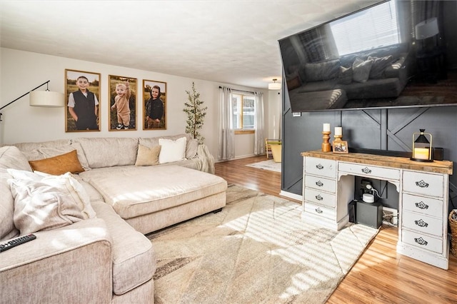 living room with light hardwood / wood-style flooring