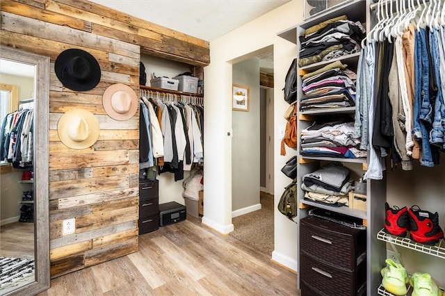 walk in closet featuring light hardwood / wood-style floors