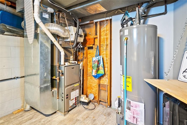 utility room with heating unit and gas water heater